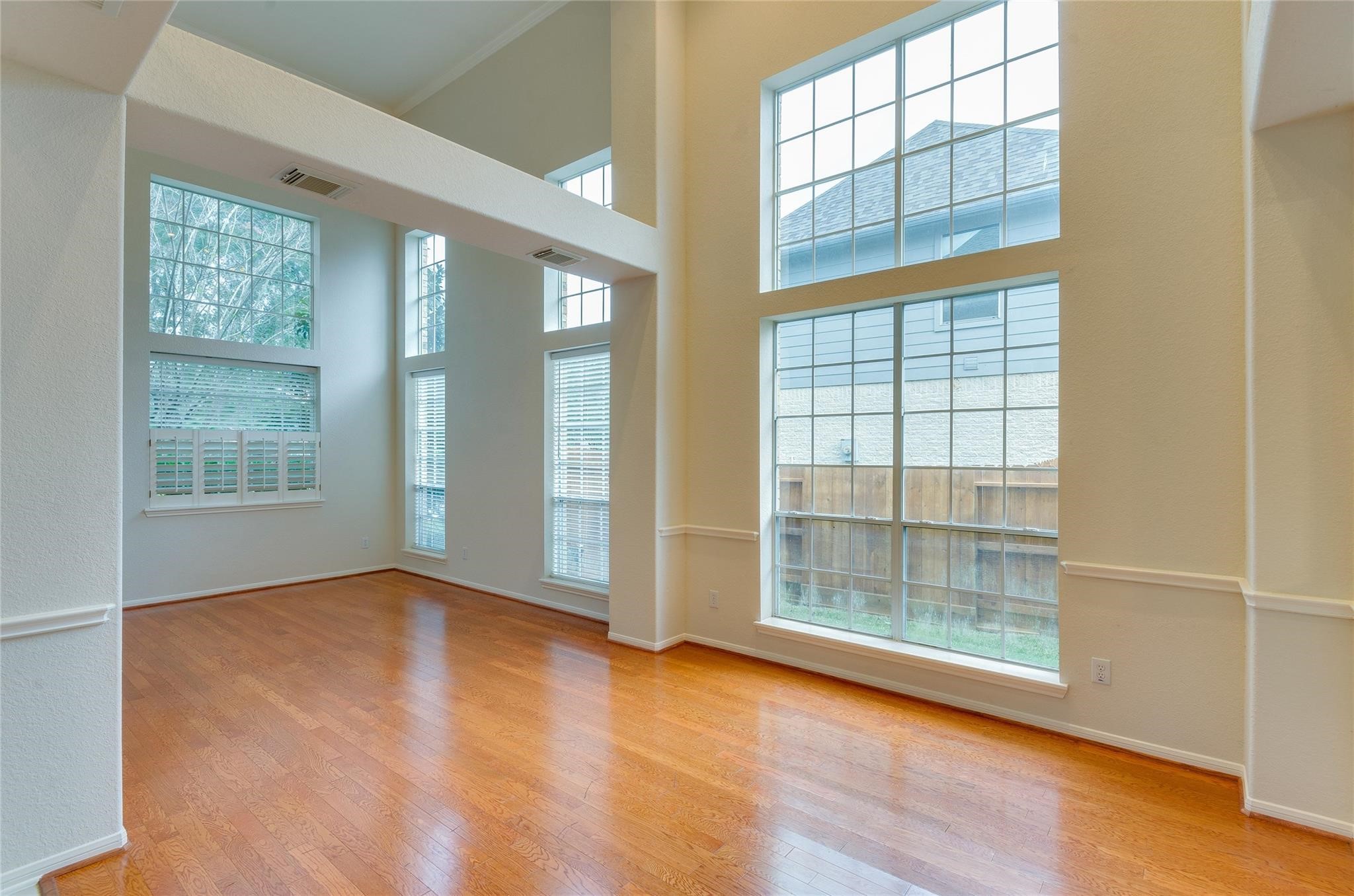 4019 Angel Spring Drive Sugar Land, TX 77479 - Photo 8 of 50 an empty room with wooden floor and windows