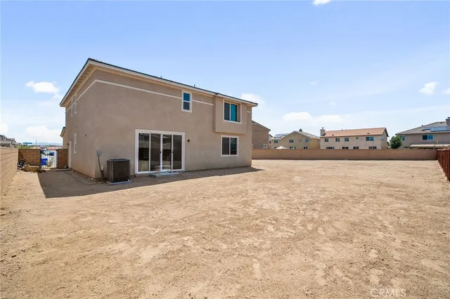 a view of a house with a snow in the yard