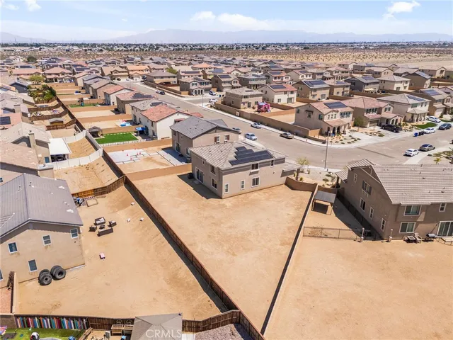a picture of a room with a book and a bed