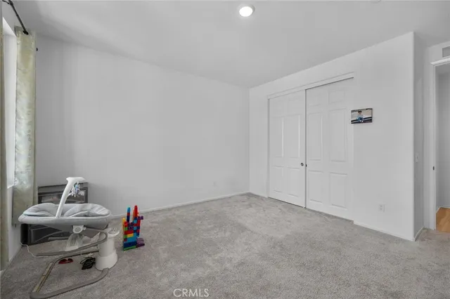 a view of storage and utility room with two washing machine