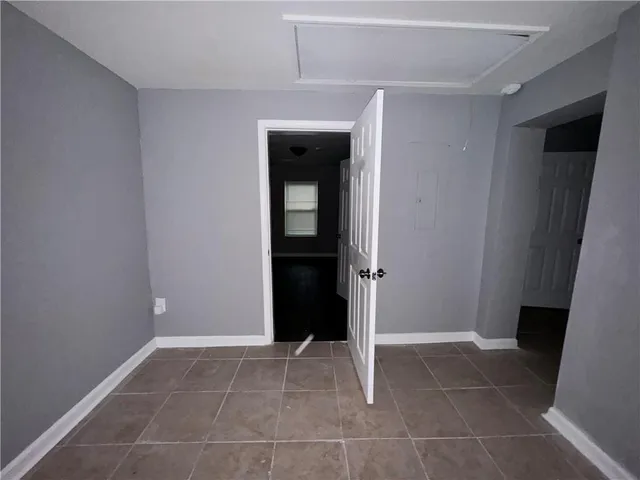 a view of an empty room with a bathroom