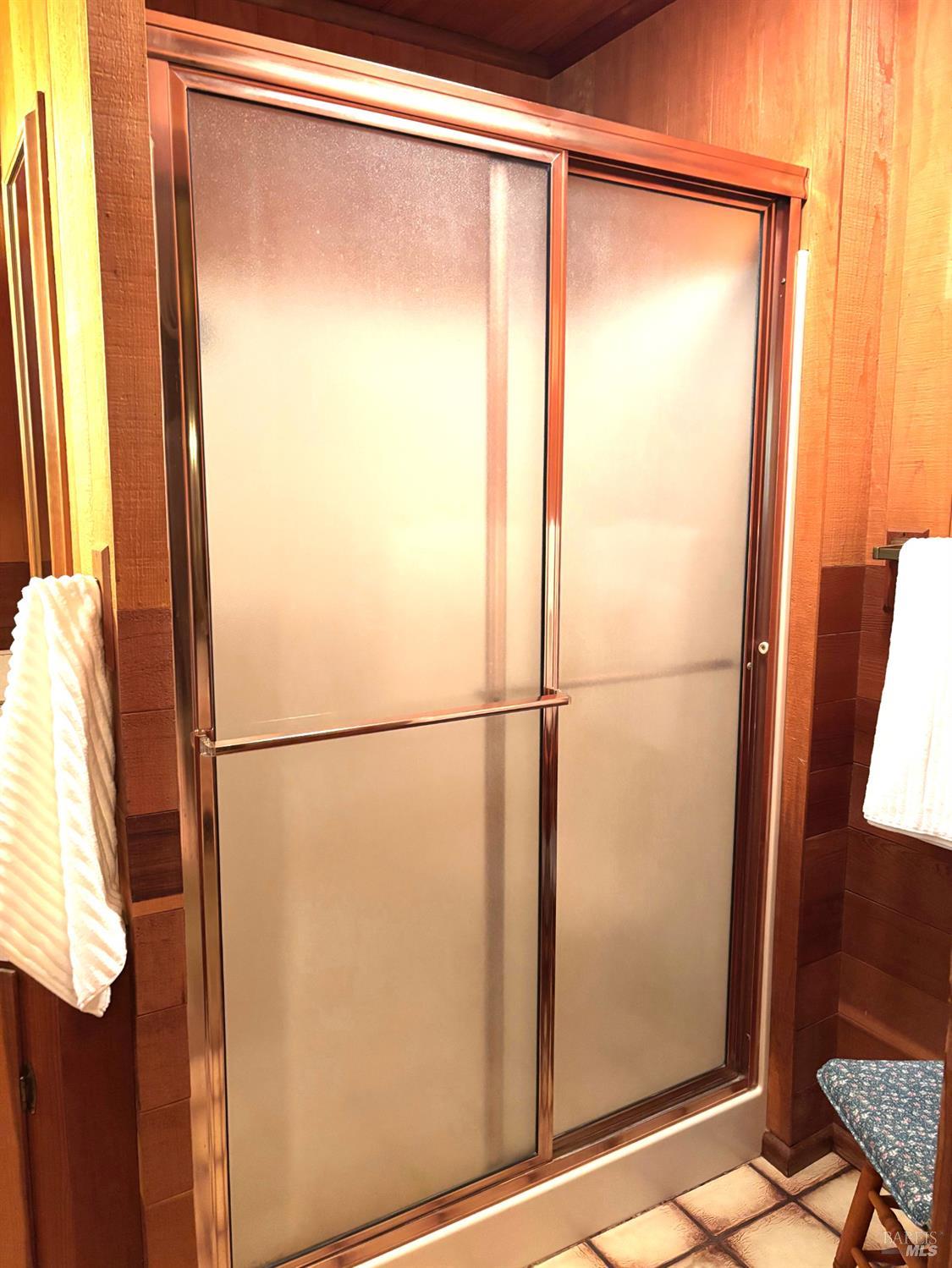 3680 Calistoga Road Santa Rosa, CA 95404 - Photo 16 of 32 a bathroom with a glass shower door