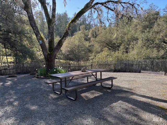 3680 Calistoga Road Santa Rosa, CA 95404 - Photo 20 of 32 a wooden bench sitting in the middle of a yard