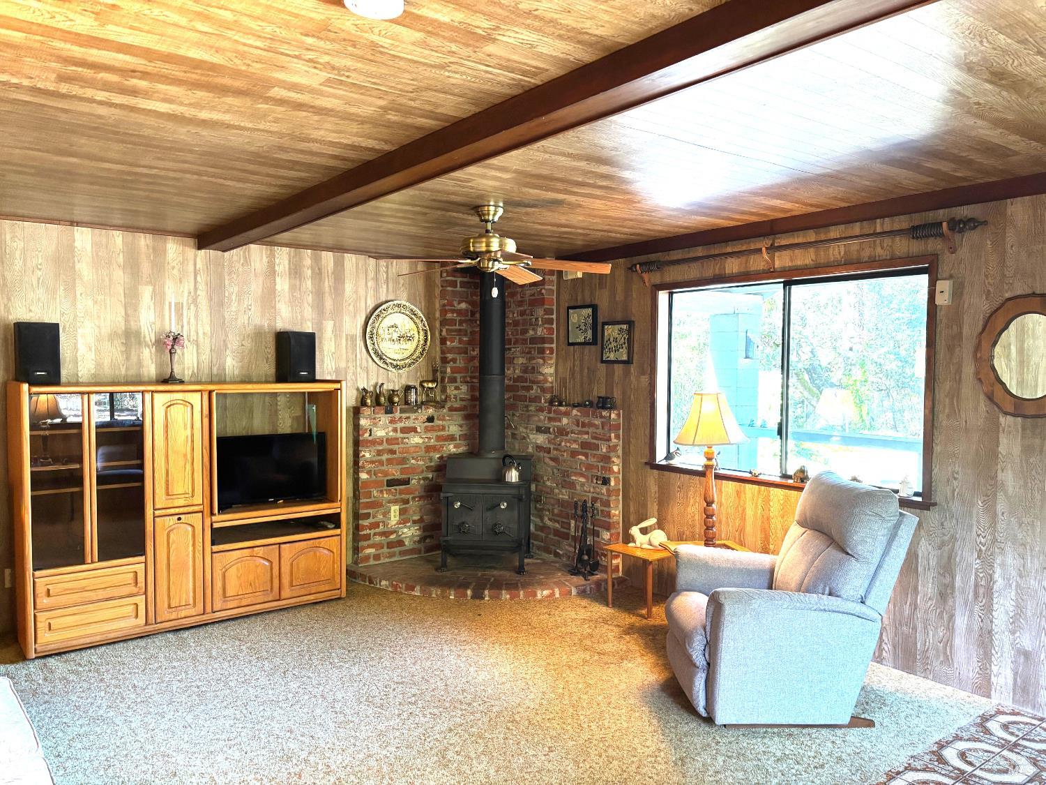 3680 Calistoga Road Santa Rosa, CA 95404 - Photo 4 of 32 a living room with furniture a flat screen tv and a large window
