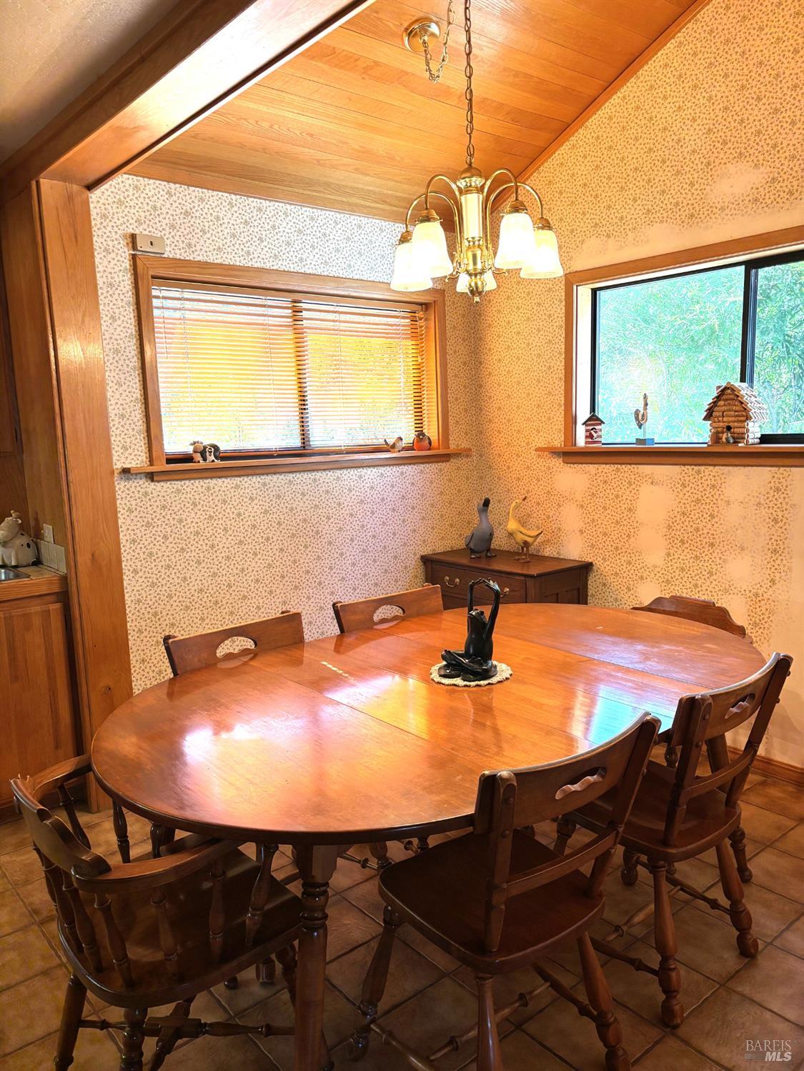3680 Calistoga Road Santa Rosa, CA 95404 - Photo 9 of 32 a dining room with wooden floor a table and chairs