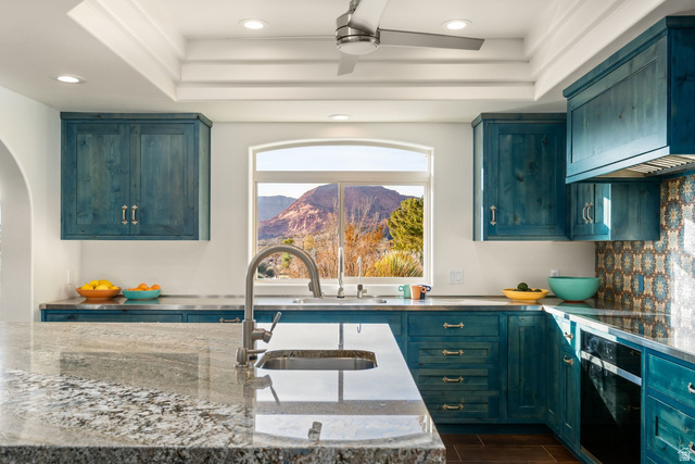 779 South Silver Road Leeds, UT 84746 - Photo 16 of 80 Kitchen with exhaust hood, black oven, ceiling fan, wood tiled floors, and recessed lighting