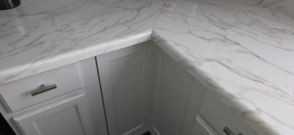 a bathroom with a shower and a sink