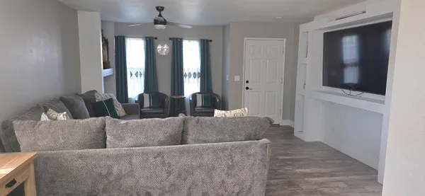 a living room with furniture and a window