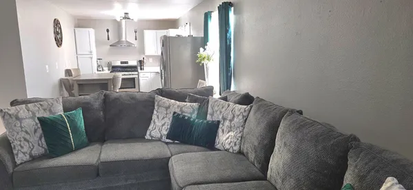 a view of hallway with wooden floor