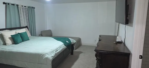 a bedroom with a bed and furniture