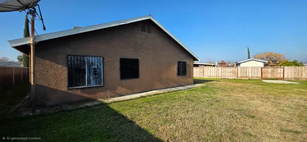 a view of a backyard of the house