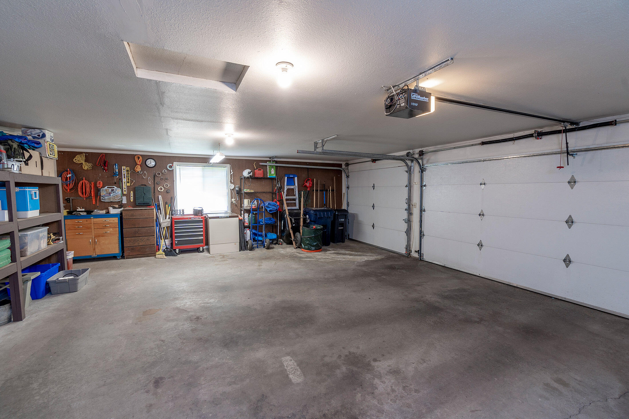 20420 Mainline Road Bend, OR 97702 - Photo 22 of 29 a view of a garage with furniture