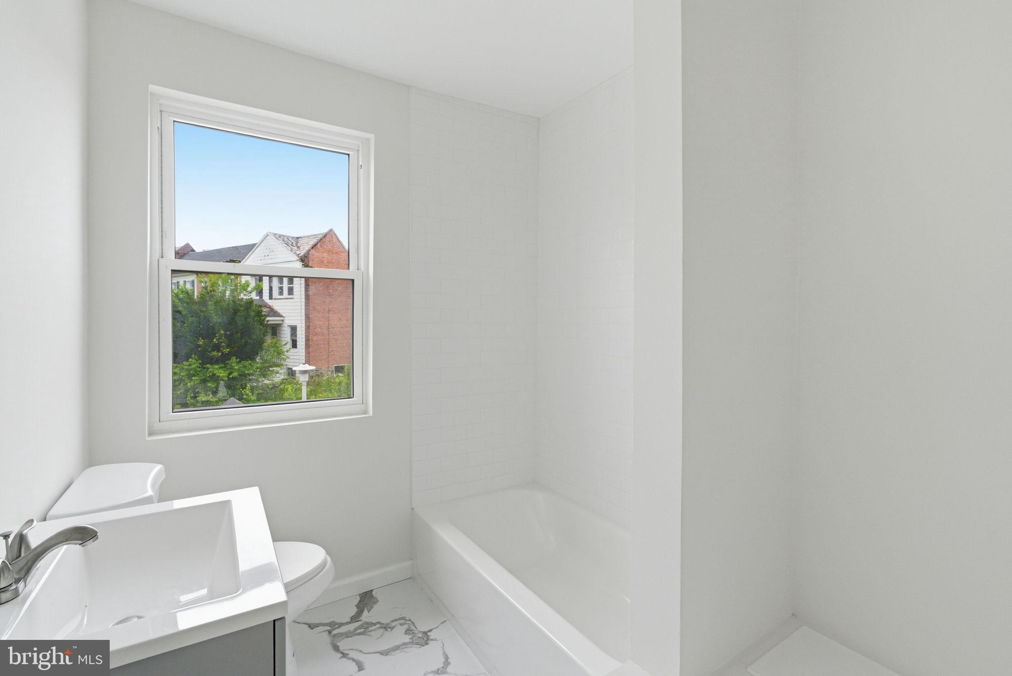 4111 Roland View Avenue Baltimore, MD 21215 - Photo 7 of 19 Bright and airy bathroom retreat.