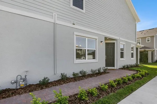 a front view of a house with garden