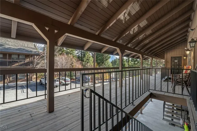 a view of porch with wooden floor