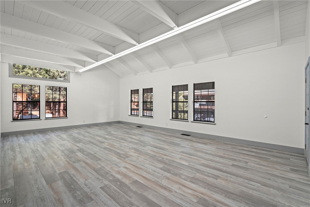 924 Incline Way, Unit N Incline Village, NV 89451 - Photo 7 of 19 an empty room with wooden floor and windows
