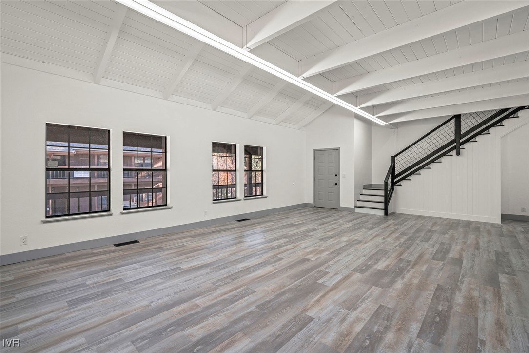 924 Incline Way, Unit N Incline Village, NV 89451 - Photo 9 of 19 a view of an empty room with wooden floor and window