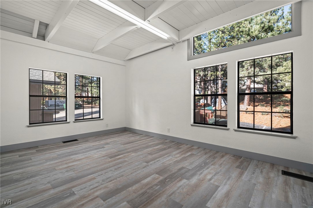 924 Incline Way, Unit N Incline Village, NV 89451 - Photo 10 of 19 an empty room with wooden floor and windows