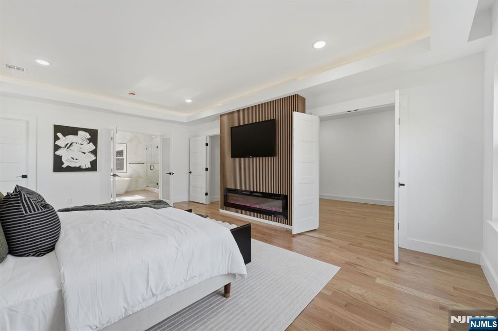 275 Longview Road Union, NJ 07083 - Photo 23 of 43 a bedroom with a bed and a flat screen tv
