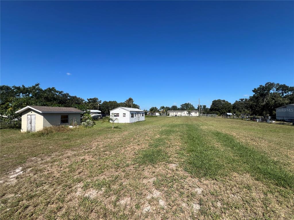 6006 Vel Street Wimauma, FL 33598 - Photo 14 of 17 a view of outdoor space and yard