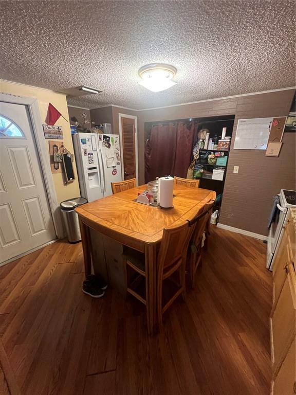 6006 Vel Street Wimauma, FL 33598 - Photo 4 of 17 a dining room with furniture and wooden floor
