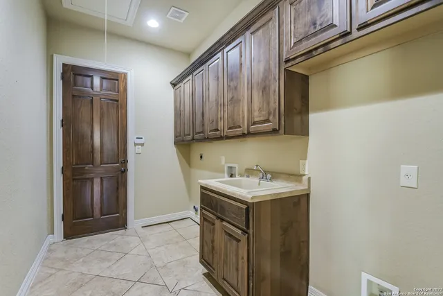 a utility room with cabinets