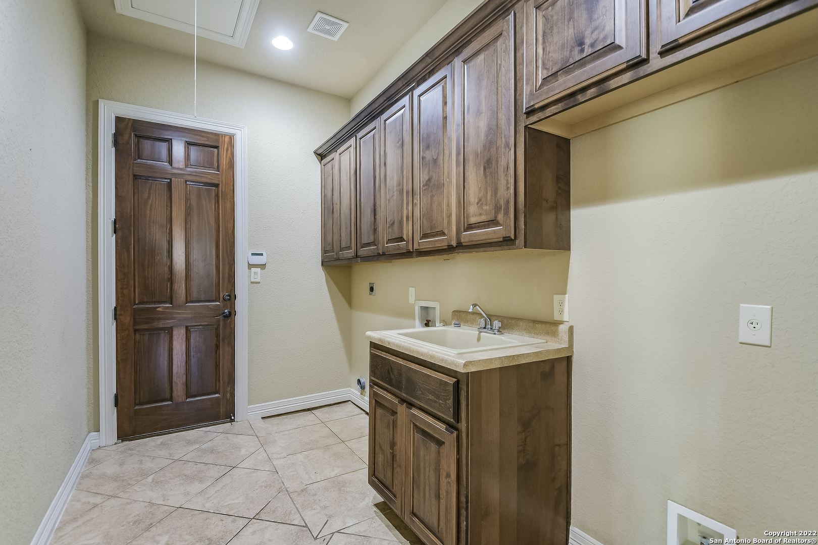 29114 Tivoli Way Boerne, TX 78015 - Photo 17 of 31 a utility room with cabinets