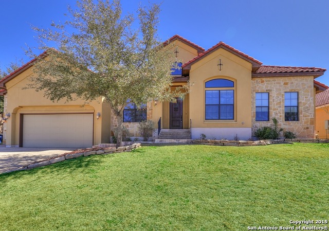 29114 Tivoli Way Boerne, TX 78015 - Photo 30 of 31 a front view of a house with a yard and garage