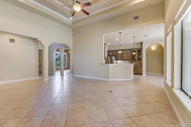 a view of a kitchen with a sink and a refrigerator