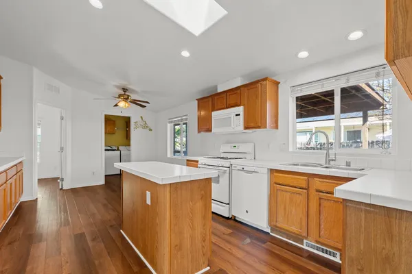 a kitchen with a sink stove and cabinets