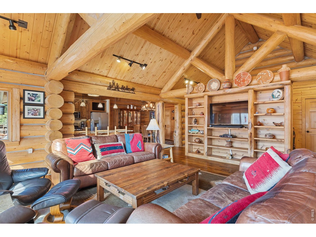 470 Big John Road Lyons, CO 80540 - Photo 11 of 44 a living room with furniture a rug and white walls