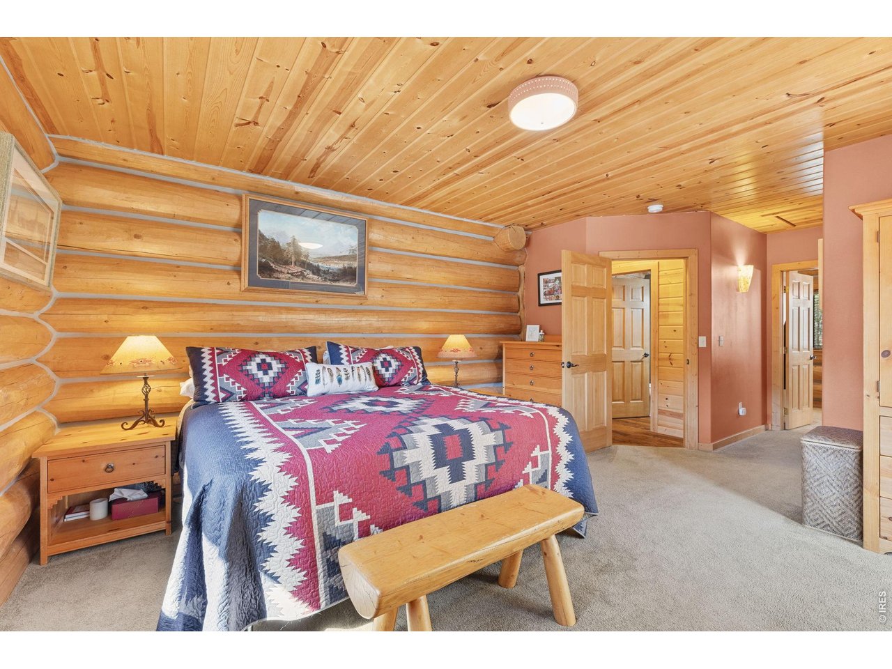 470 Big John Road Lyons, CO 80540 - Photo 18 of 44 a bedroom with a bed and a night stand