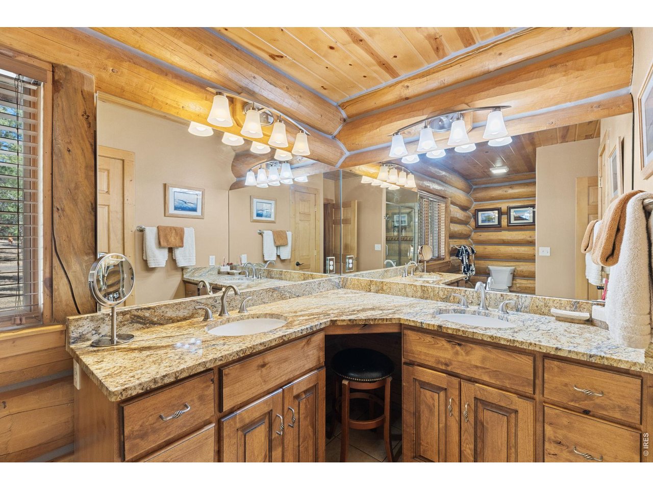 470 Big John Road Lyons, CO 80540 - Photo 21 of 44 a bathroom with a granite countertop sink and a mirror