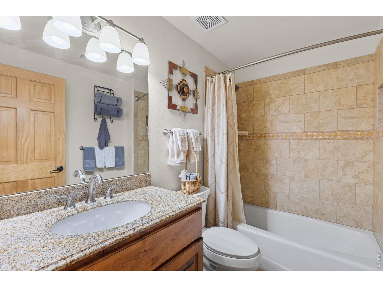 470 Big John Road Lyons, CO 80540 - Photo 28 of 44 a bathroom with a granite countertop sink a toilet and shower