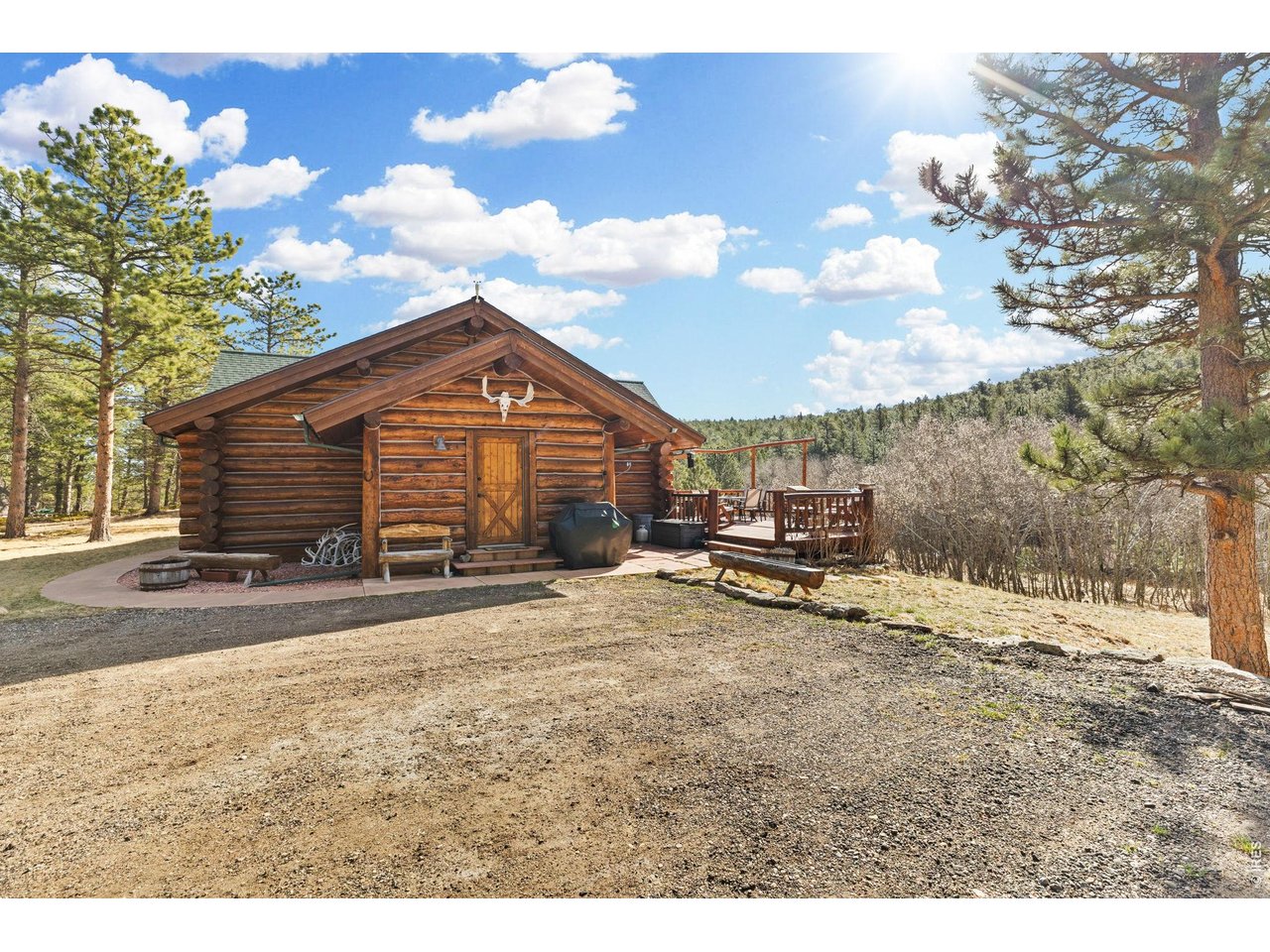 470 Big John Road Lyons, CO 80540 - Photo 40 of 44 a view of a house with backyard and sitting area