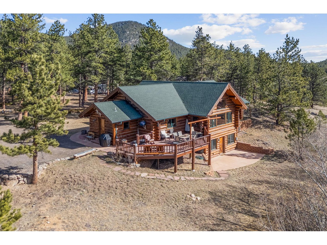 470 Big John Road Lyons, CO 80540 - Photo 4 of 44 a view of a patio with table and chairs with wooden floor and fence