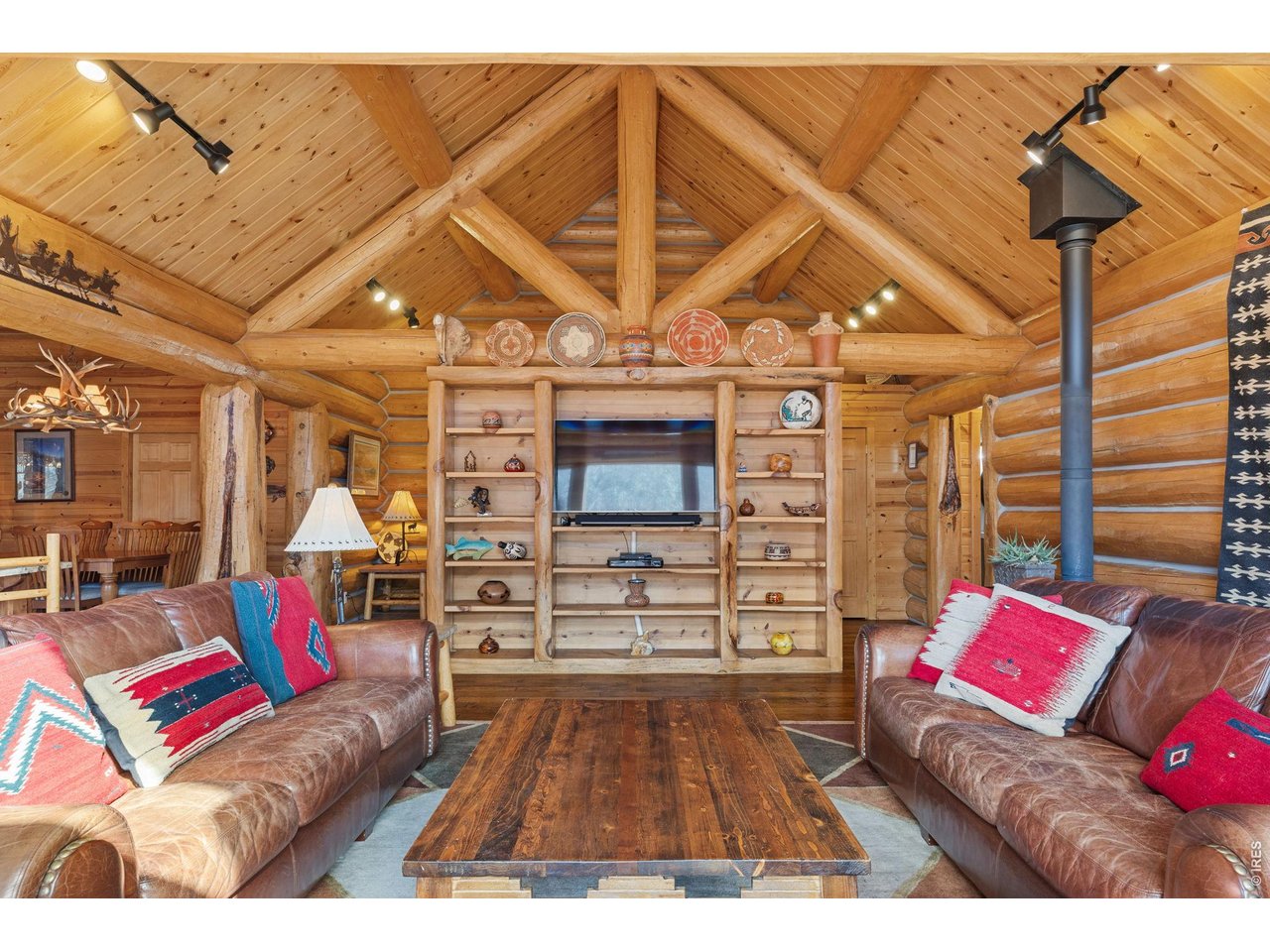 470 Big John Road Lyons, CO 80540 - Photo 8 of 44 a living room with furniture and a fireplace