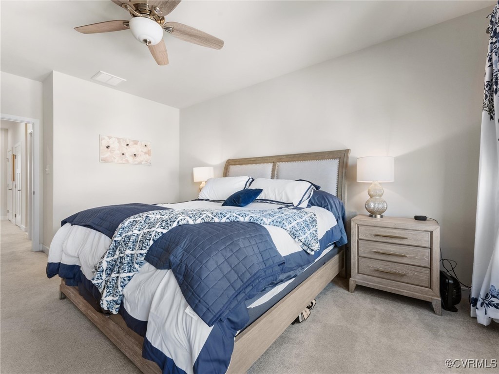 14100 Millpointe Road Midlothian, VA 23114 - Photo 25 of 46 a bedroom with a bed and a ceiling fan