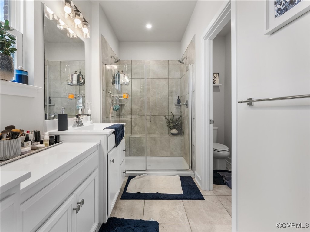 14100 Millpointe Road Midlothian, VA 23114 - Photo 27 of 46 a bathroom with a sink a toilet and shower