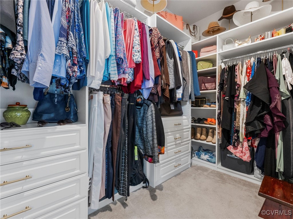 14100 Millpointe Road Midlothian, VA 23114 - Photo 30 of 46 a view of walk in closet with clothes and shoes