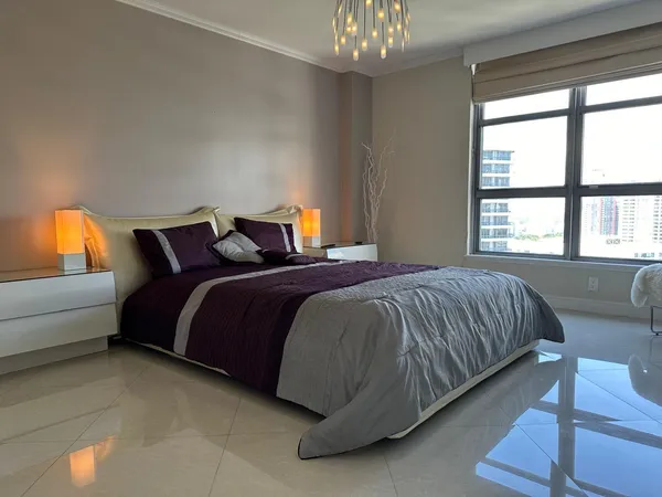 a bathroom with a granite countertop sink mirror and shower