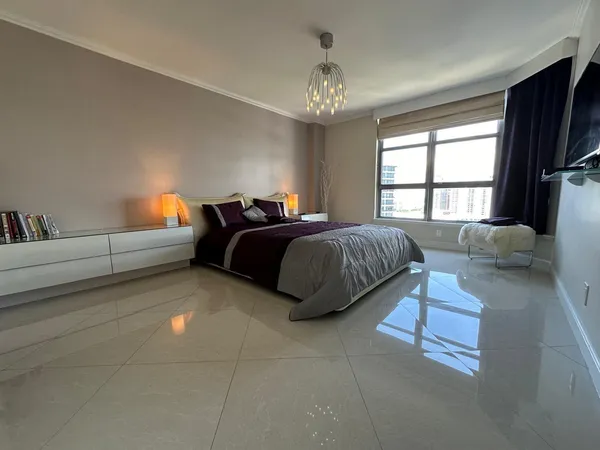 a view of a street with cars parked