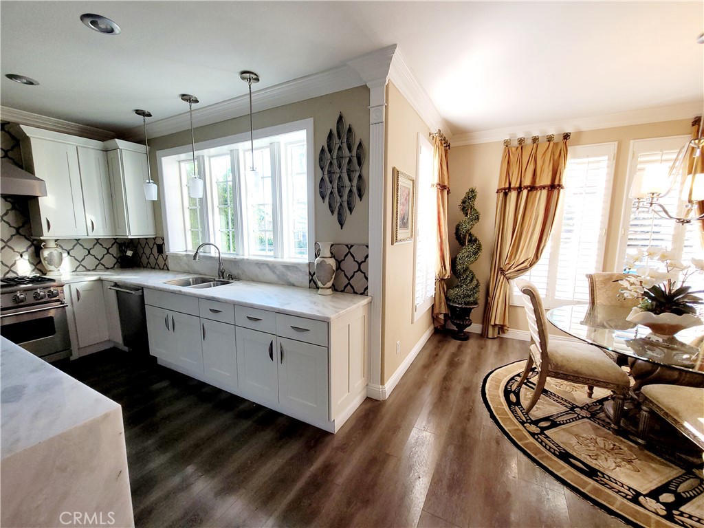 14119 Ashton Lane Riverside, CA 92508 - Photo 29 of 47 a kitchen with a sink appliances cabinets and a window