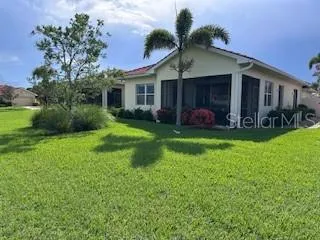 a view of a house with a yard and porch