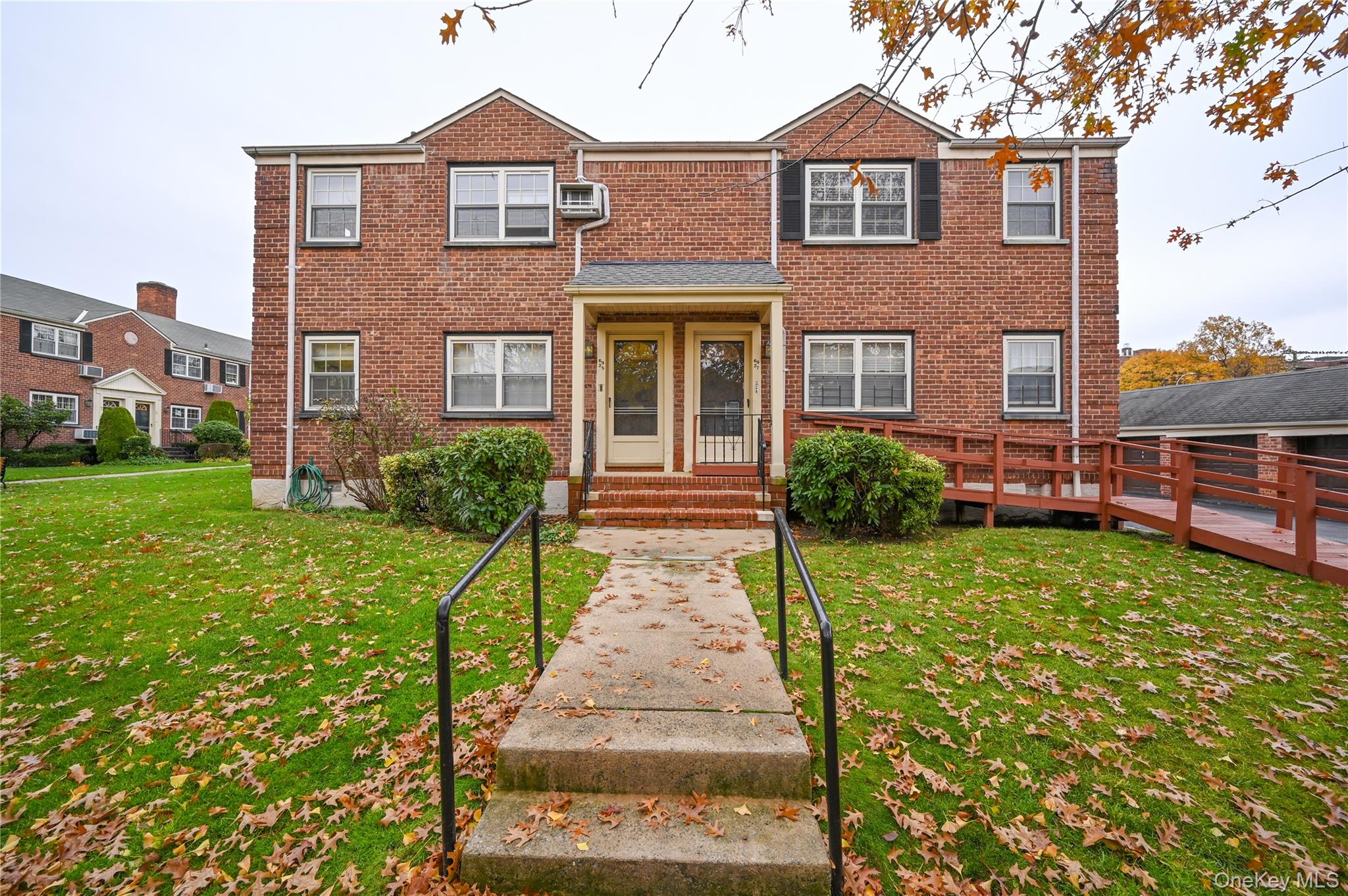 a front view of a house with garden