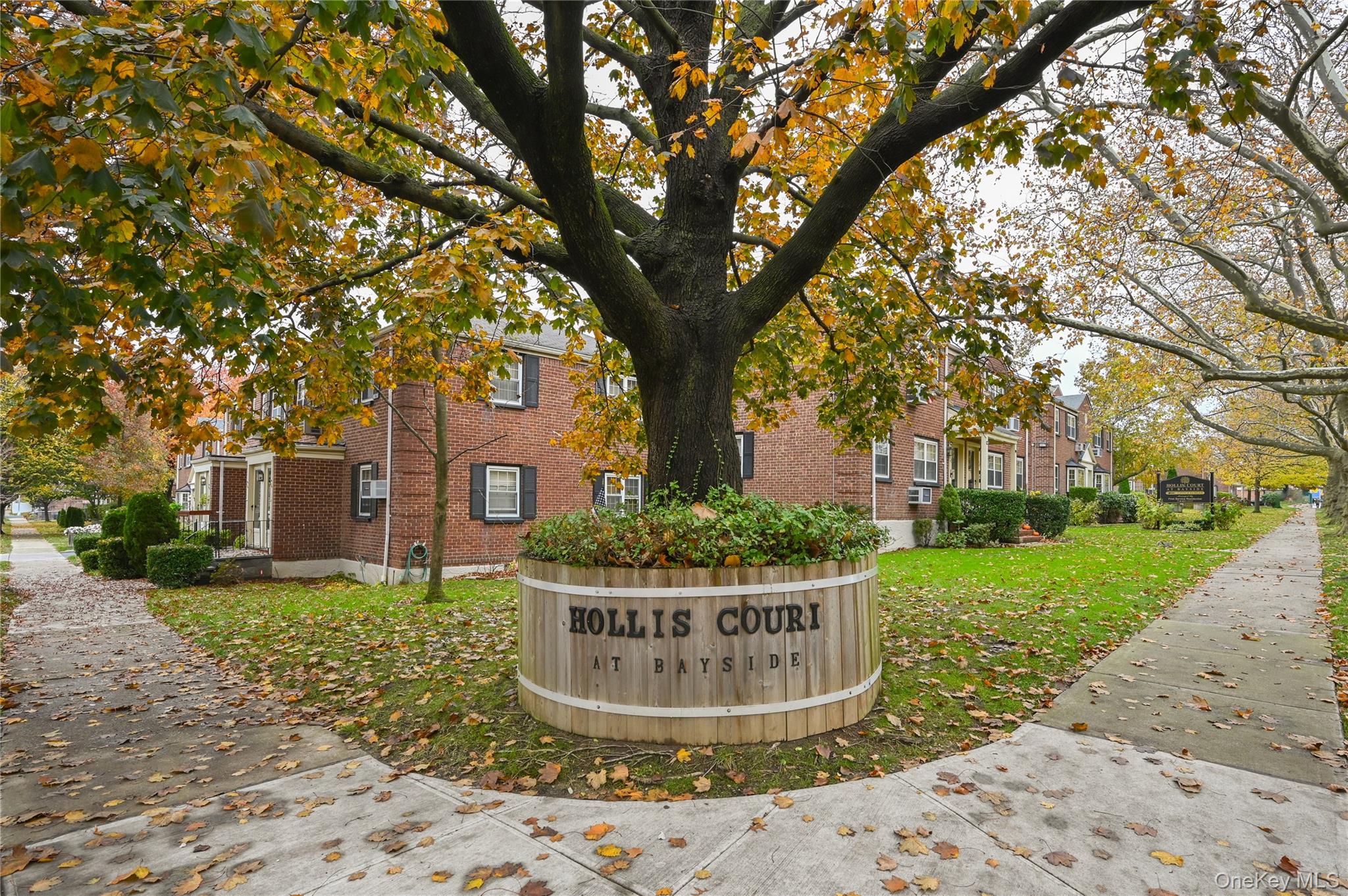 69-25 215th Street, Unit A Queens, NY 11364 - Photo 16 of 17 a front view of a house with a yard