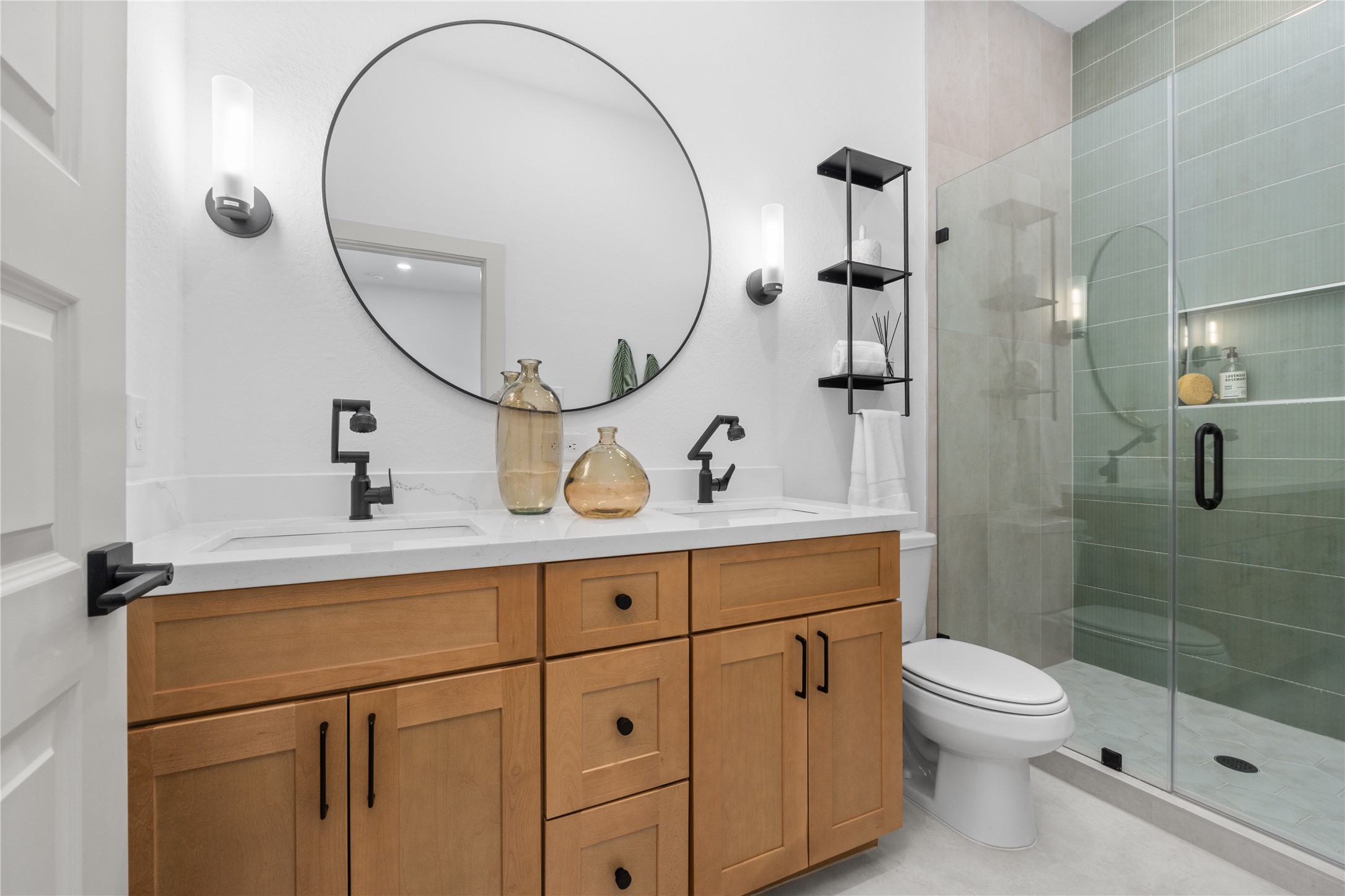 9819 Turnbow Street, Unit CD Houston, TX 77029 - Photo 19 of 32 a bathroom with a sink a toilet and a mirror