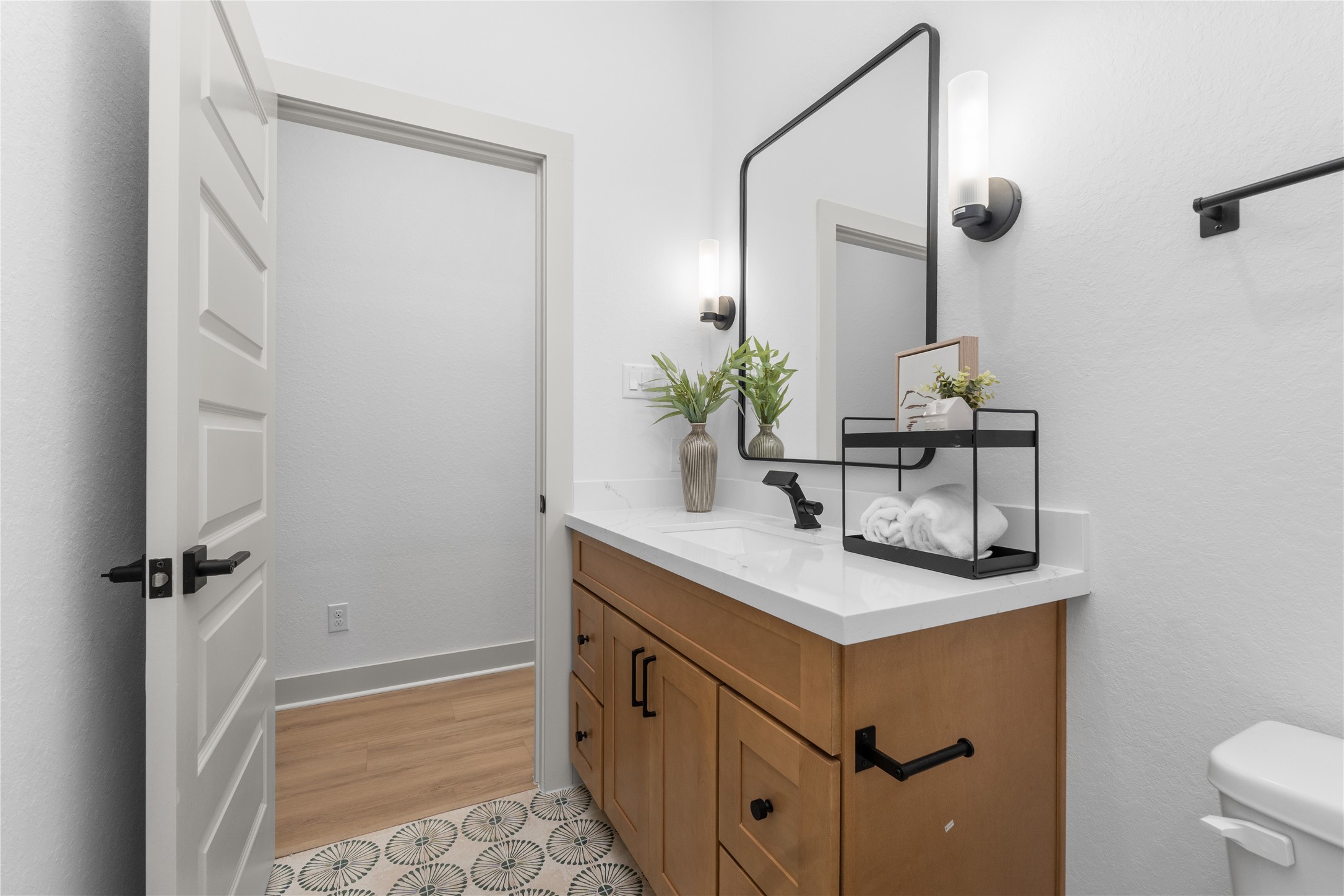 9819 Turnbow Street, Unit CD Houston, TX 77029 - Photo 21 of 32 a bathroom with a sink and a mirror