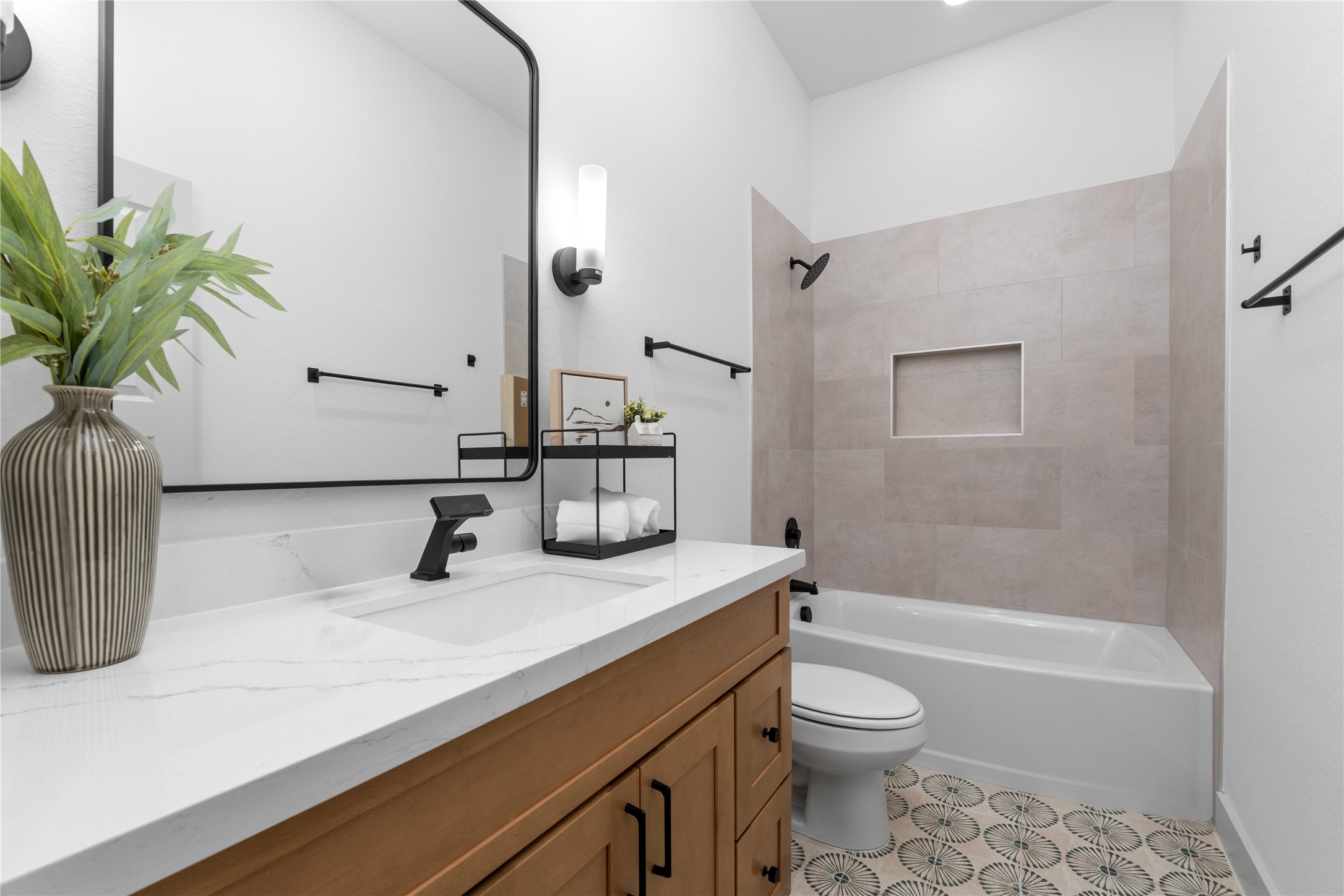 9819 Turnbow Street, Unit CD Houston, TX 77029 - Photo 22 of 32 a bathroom with a granite countertop sink a toilet and shower
