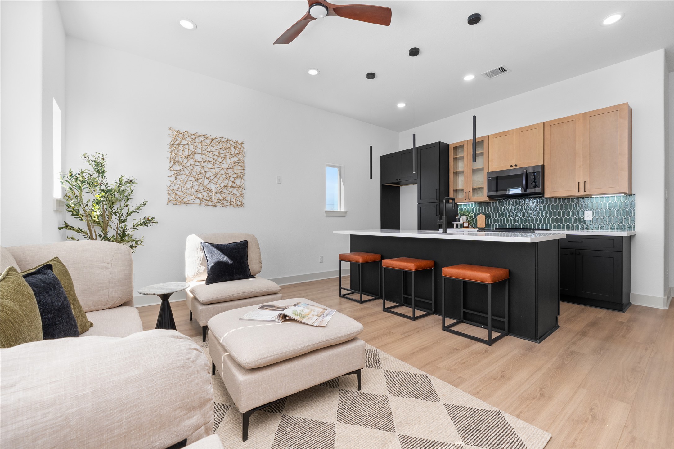 9819 Turnbow Street, Unit CD Houston, TX 77029 - Photo 6 of 32 a living room with furniture and kitchen view